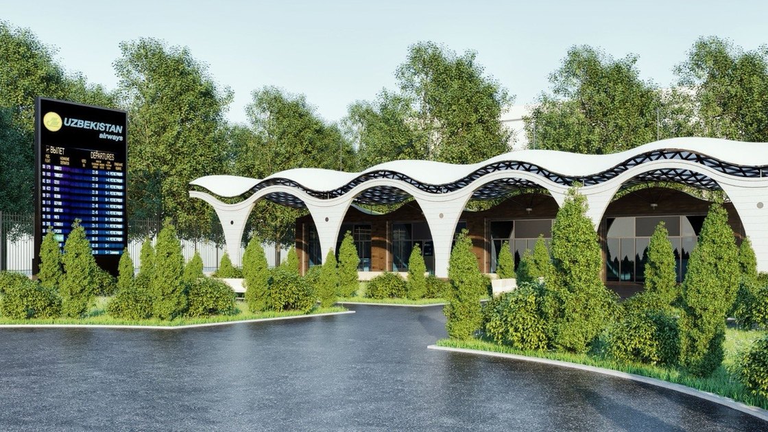 The waiting zone seen along its length: a row of pointed white arches under a dark perforated roof band