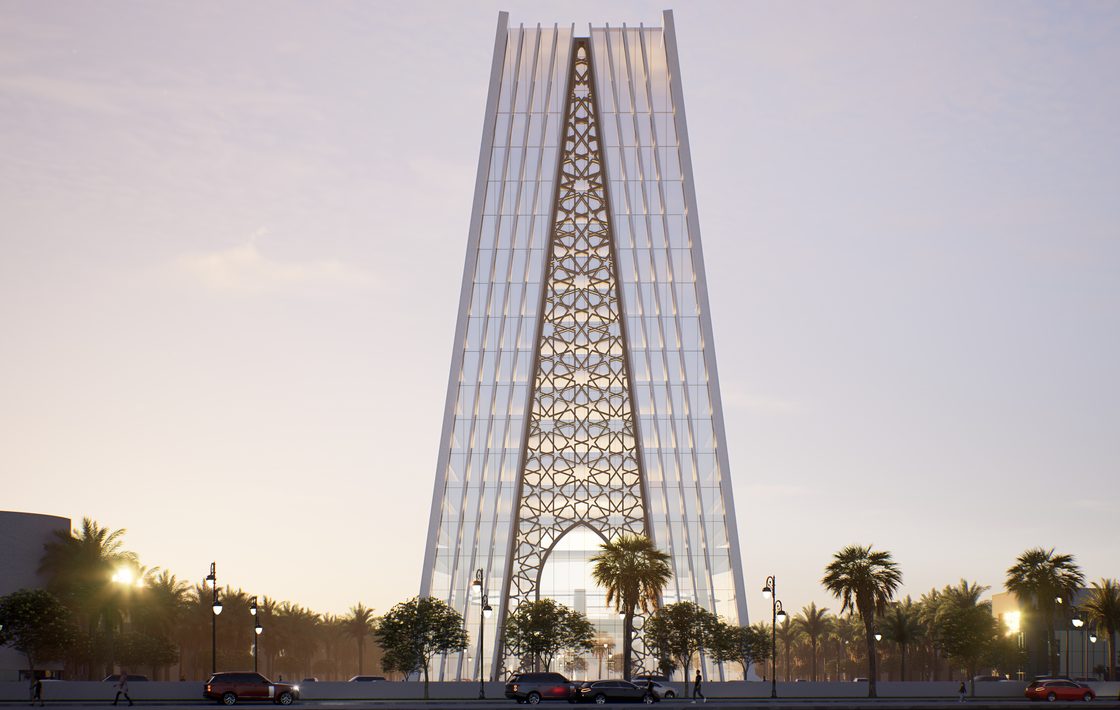 Dusk close-up of the tower's gold geometric-pattern spine between the white shells.