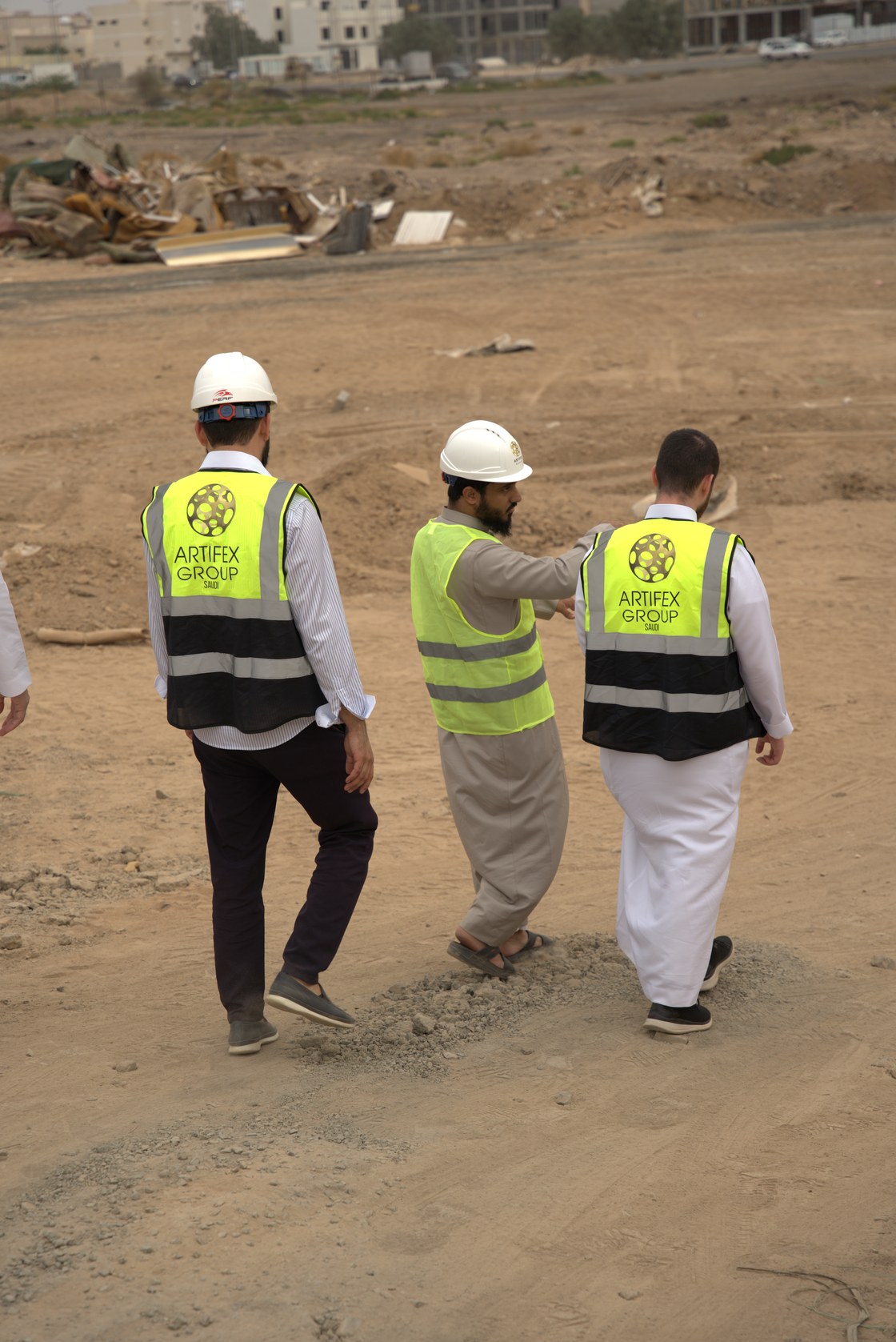 A site walk in progress on open ground