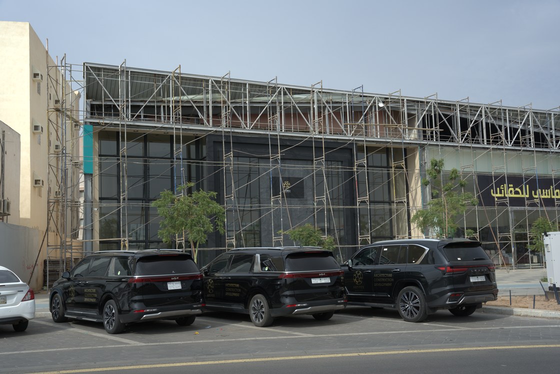 The same building from the road, with the practice's vehicles outside