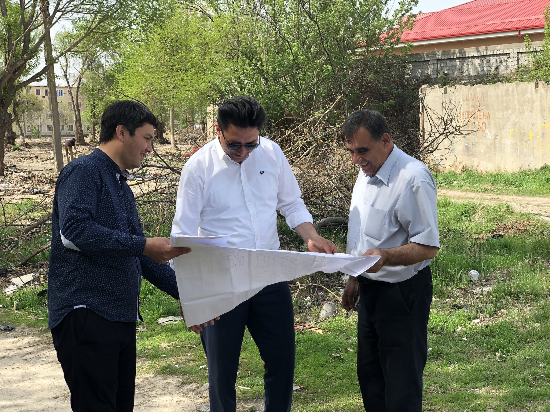Reviewing a drawing outside the studio